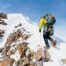 Climber topping out on a mountain ridge, representing an adaptive leadership challenge