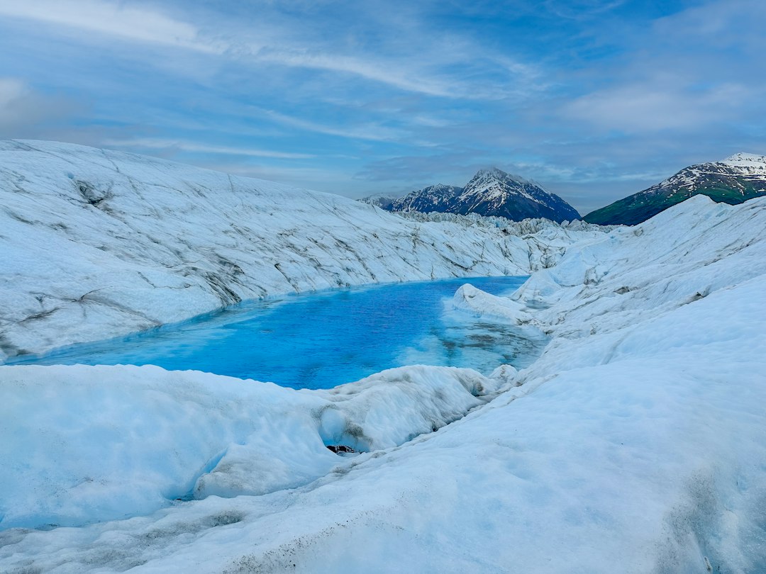 Lewin Change Model Unfreeze Refreeze Cracking glacier ice, symbolising Lewin's unfreeze-change-refreeze change model